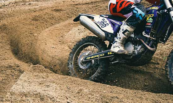 Dirt bike in a rutted corner
